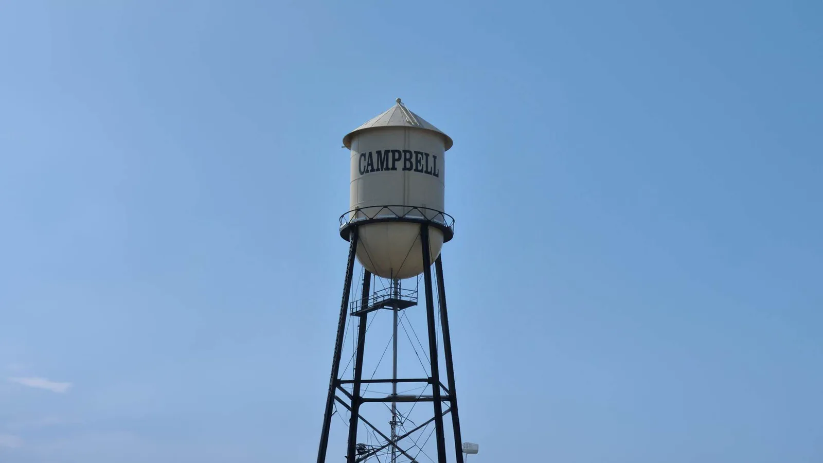 Historic Campbell water tower against a clear blue sky