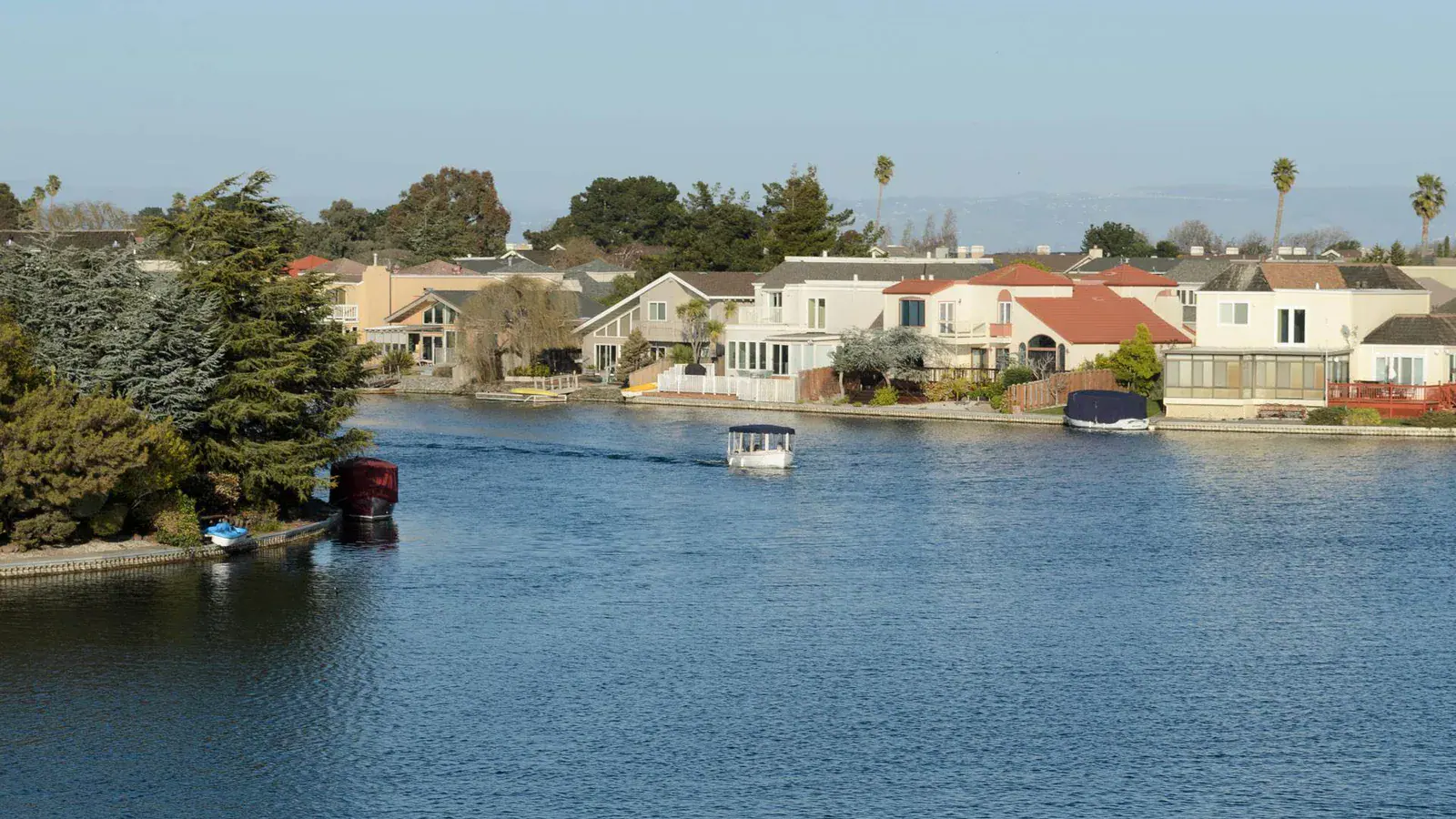 Waterfront homes and boats along a residential lagoon in Foster City