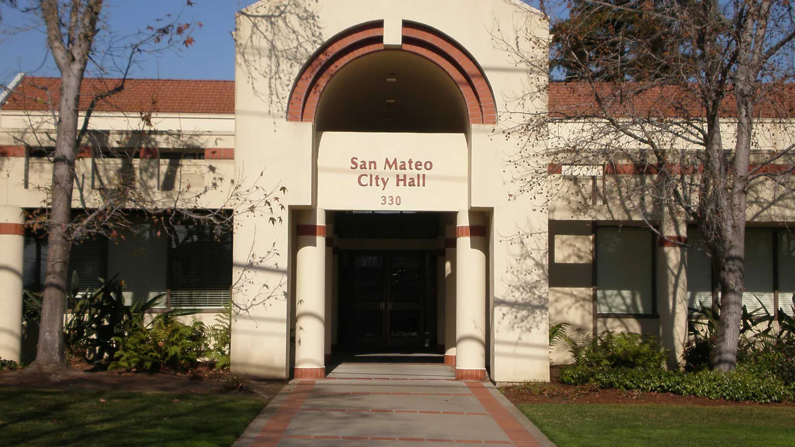 San Mateo City Hall entrance with an arched brick doorway and street number 330.