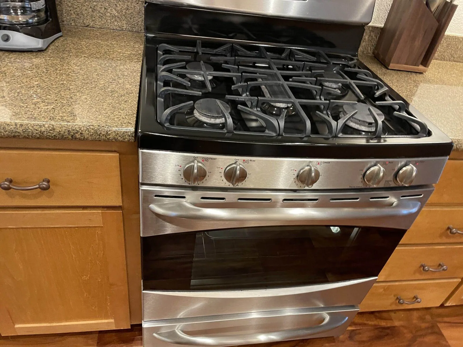 Cleaned gas stovetop with cast-iron grates on a granite counter in a San Jose kitchen