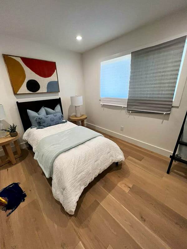 Hardwood floors, bed.