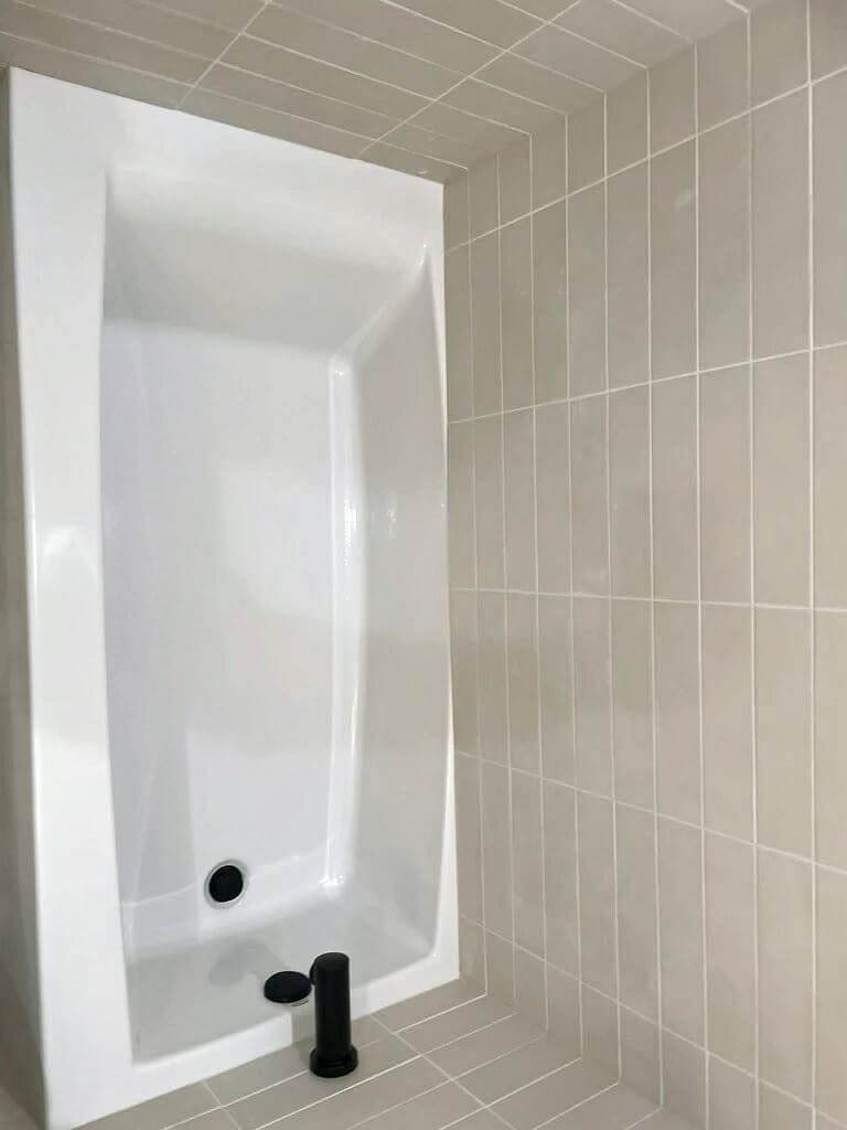 white, tiled bathroom