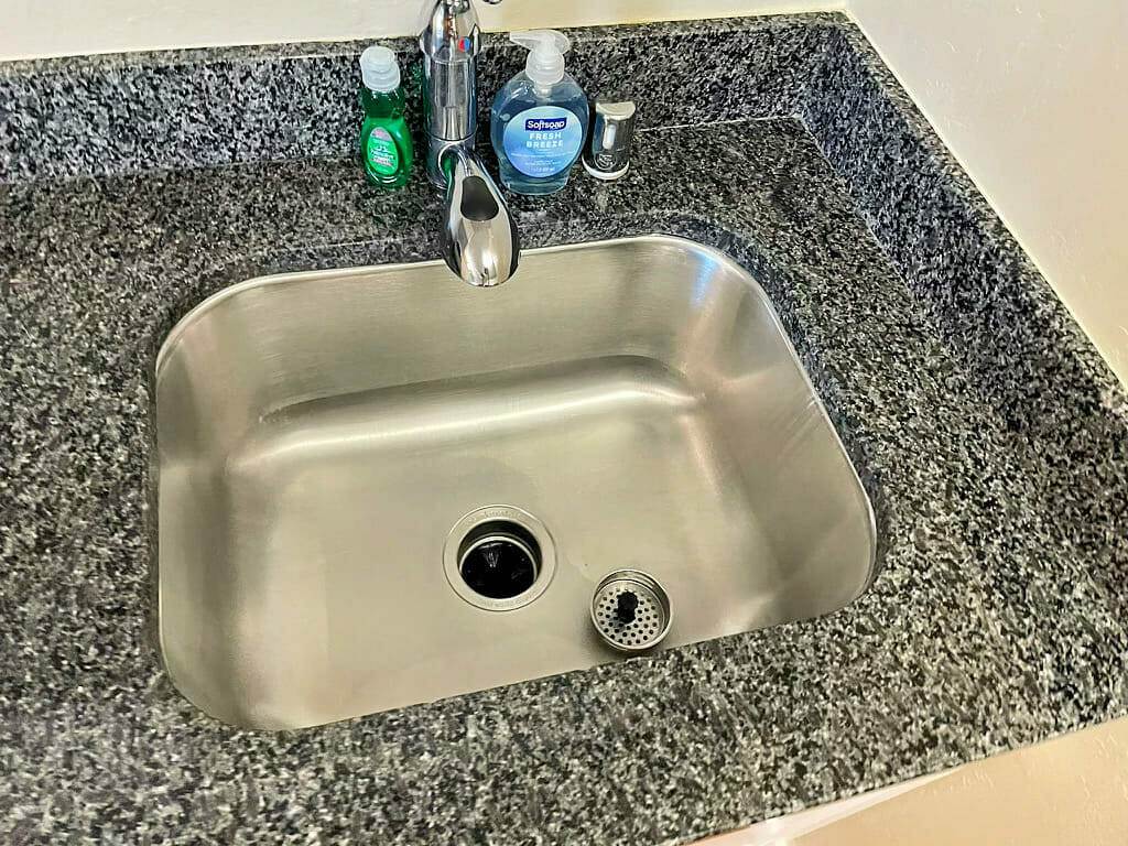 Bathroom sink, granite counter tops.