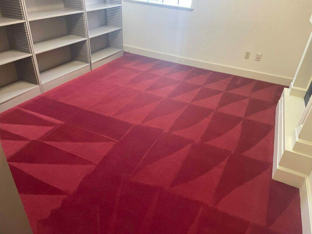 Commercial room with red carpet.