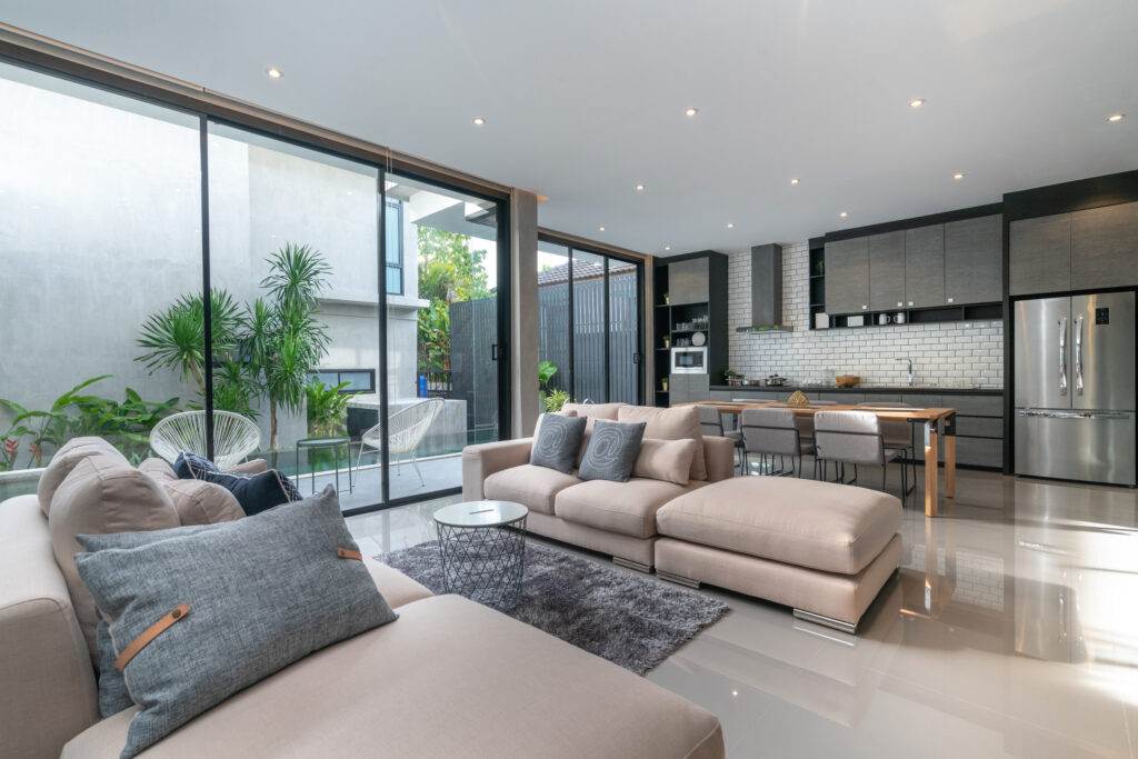 A modern living room with sliding glass doors, perfect for Airbnb guests.