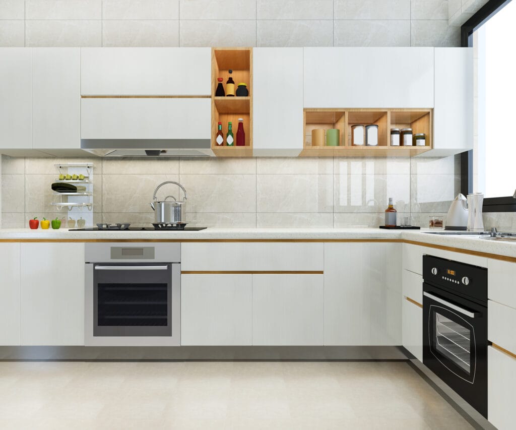 Modern kitchen with white cabinets, built-in oven, gas stove, and open shelves displaying spices, jars, and bottles; a window brings in natural light—perfect for Santa Clara homeowners seeking Kitchen-Only Cleaning.